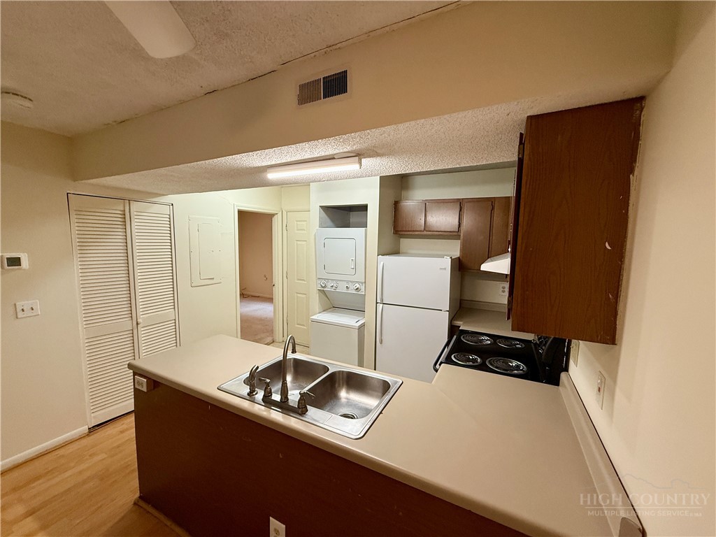 229 East King Street, Unit 30 Boone, NC 28607 - Photo 10 of 19 a room with storage and utility