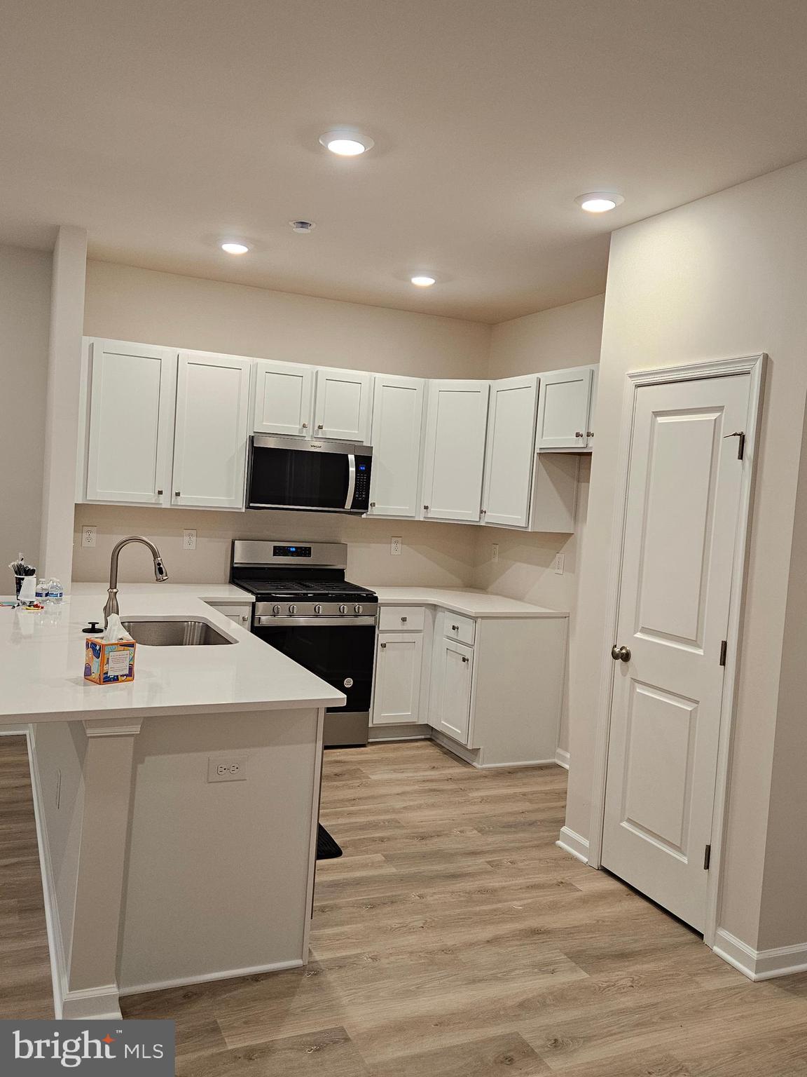 21 Alexander Way Westampton, NJ 08060 - Photo 7 of 25 a kitchen with a sink stainless steel appliances and cabinets