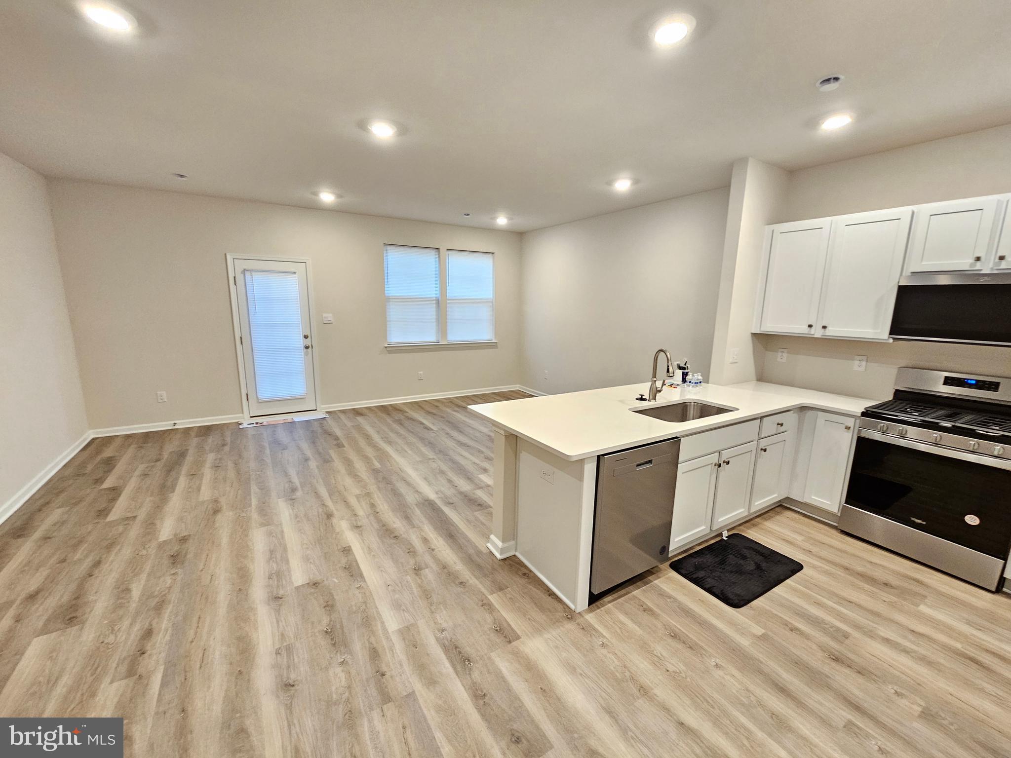 21 Alexander Way Westampton, NJ 08060 - Photo 8 of 25 a view of kitchen with sink microwave and cabinets