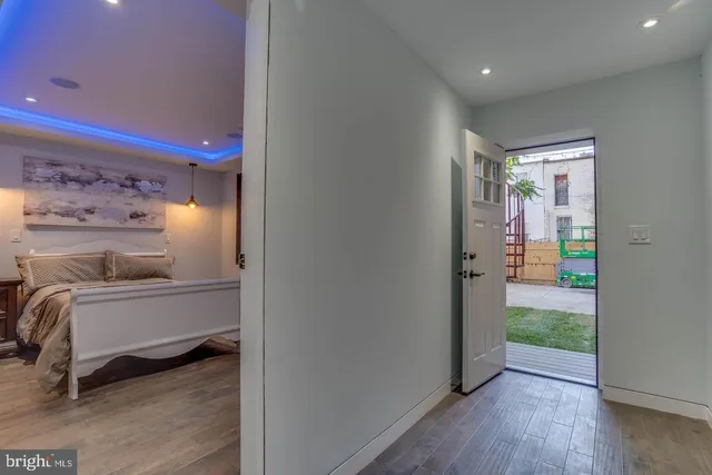 a bed room with a bed and a painting