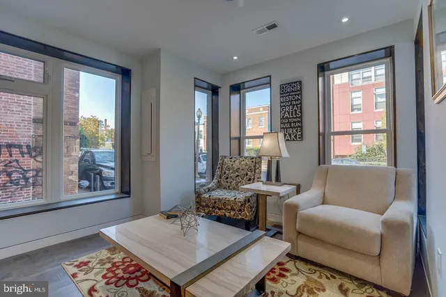 a living room with furniture and a window