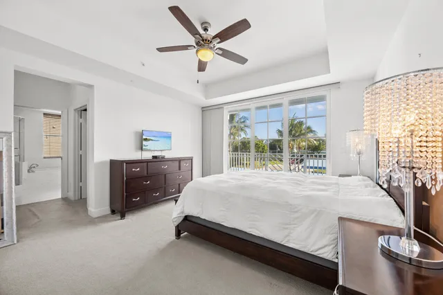 a bed sitting in a room next to a window