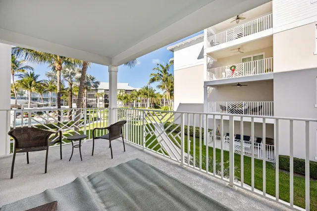 a view of a balcony with chairs