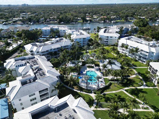 an aerial view of a house with a lake view