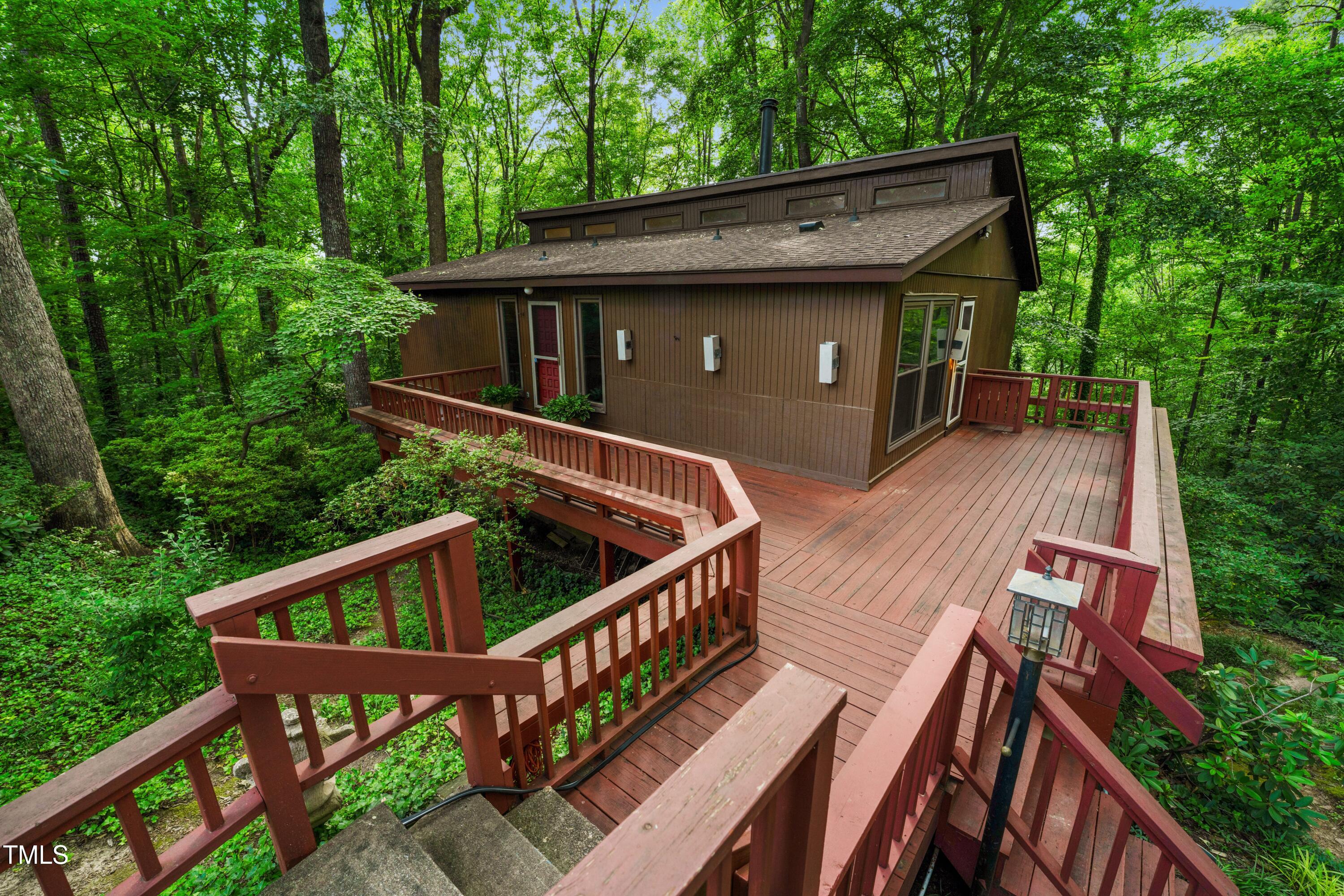 3416 Ocotea Street Raleigh, NC 27607 - Photo 1 of 46 a view of house with deck and outdoor seating