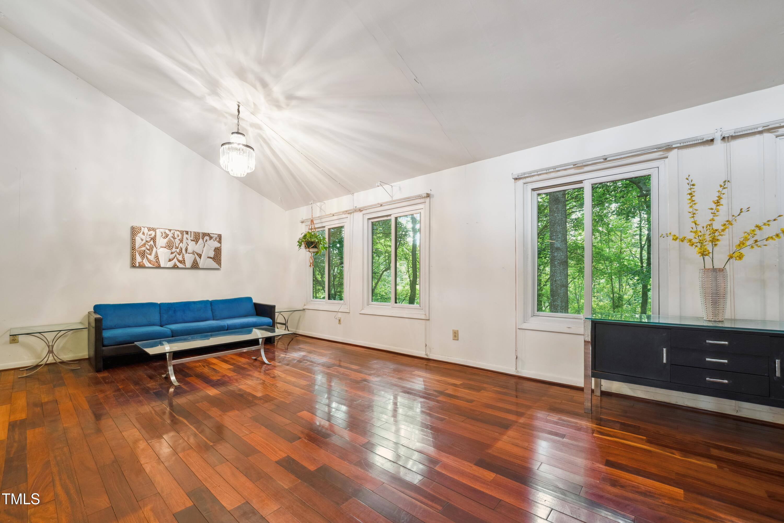 3416 Ocotea Street Raleigh, NC 27607 - Photo 13 of 46 a view of a livingroom with furniture window and wooden floor