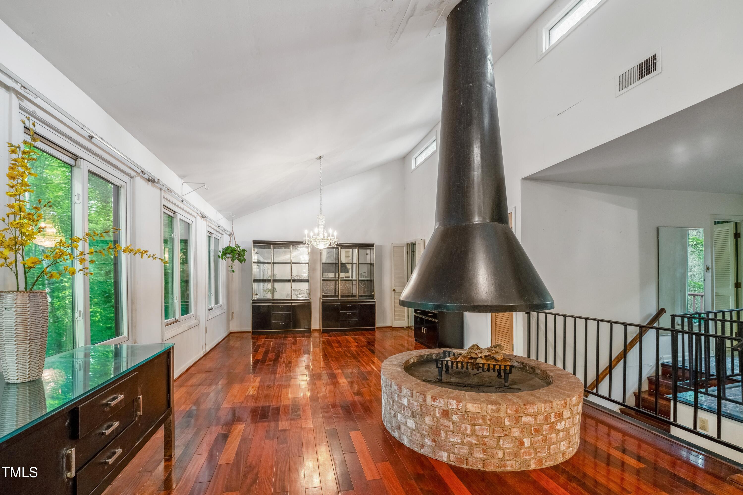 3416 Ocotea Street Raleigh, NC 27607 - Photo 16 of 46 a living room with furniture and a flat screen tv