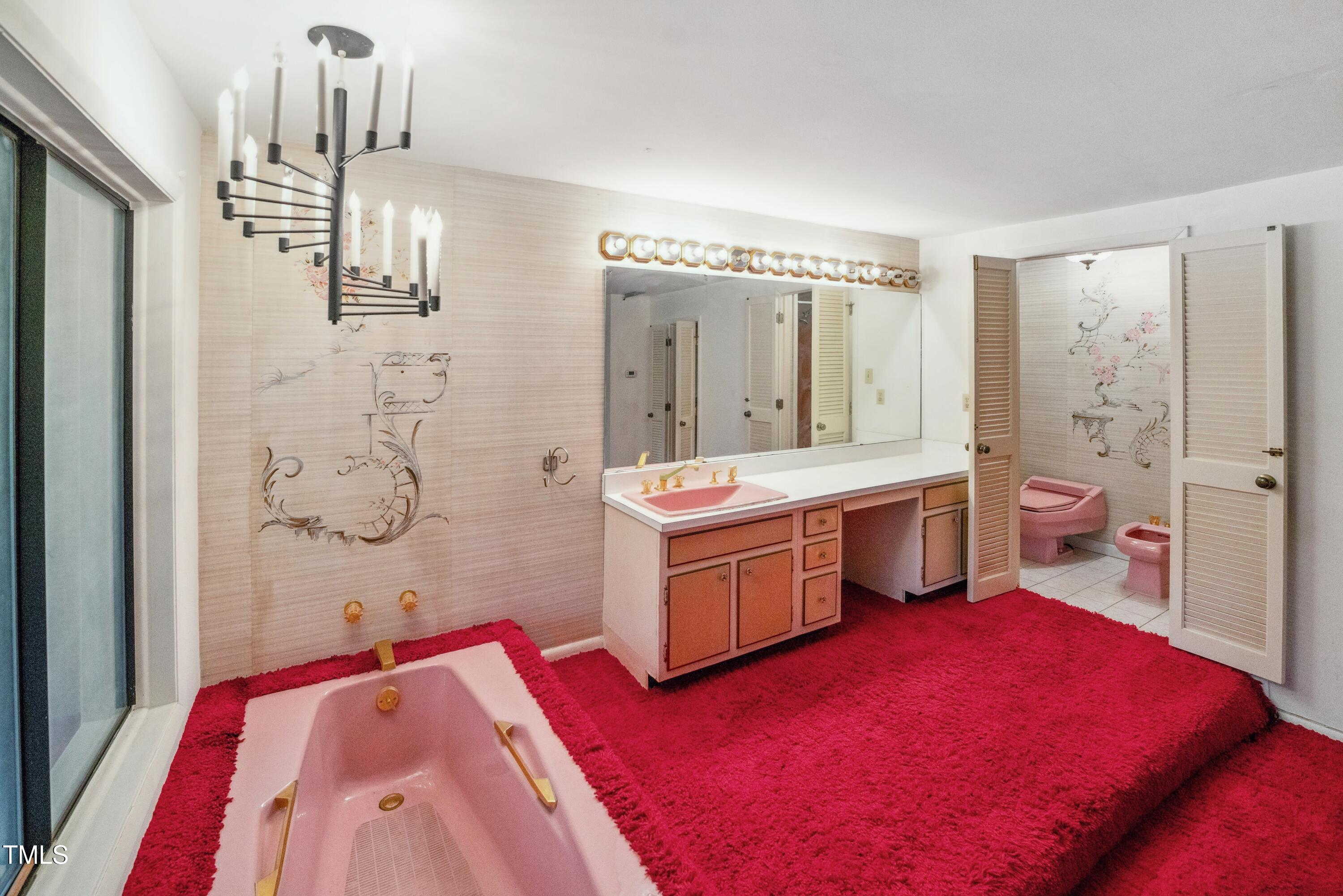 3416 Ocotea Street Raleigh, NC 27607 - Photo 23 of 46 a spacious bathroom with a double vanity sink a mirror and shower