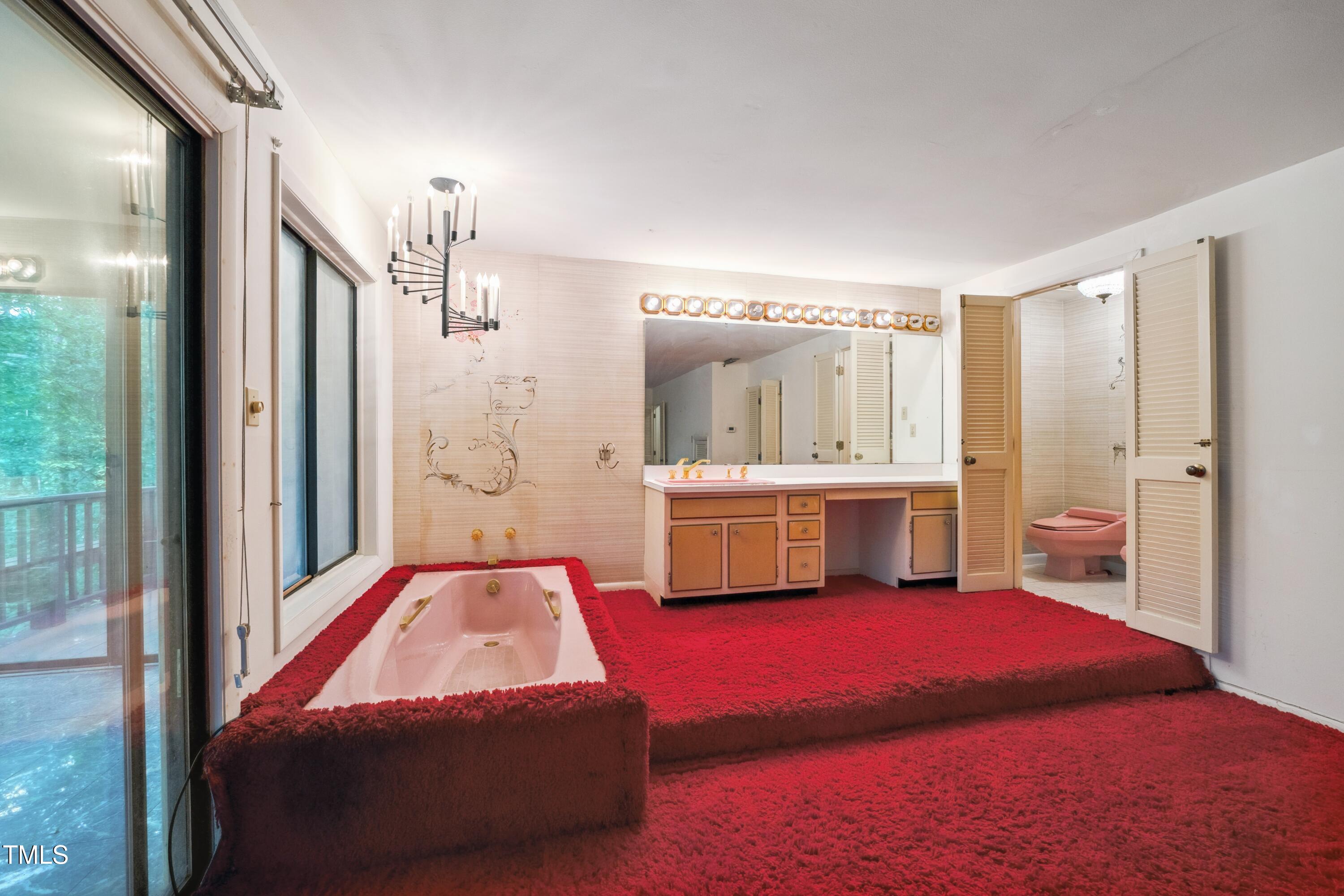3416 Ocotea Street Raleigh, NC 27607 - Photo 24 of 46 a en suite bathroom with a double vanity sink a mirror and a shower