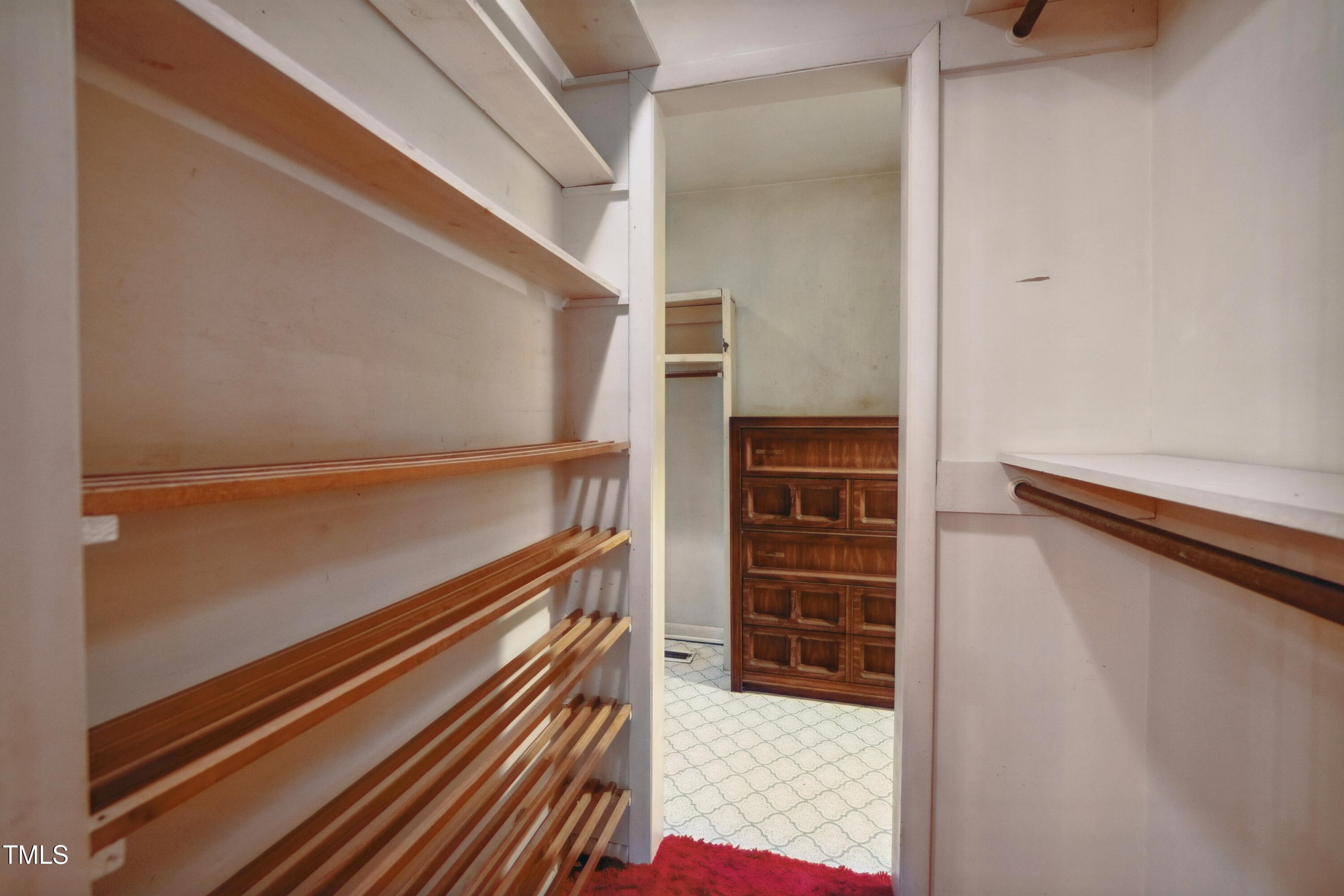 3416 Ocotea Street Raleigh, NC 27607 - Photo 29 of 46 a view of walk in closet with empty racks
