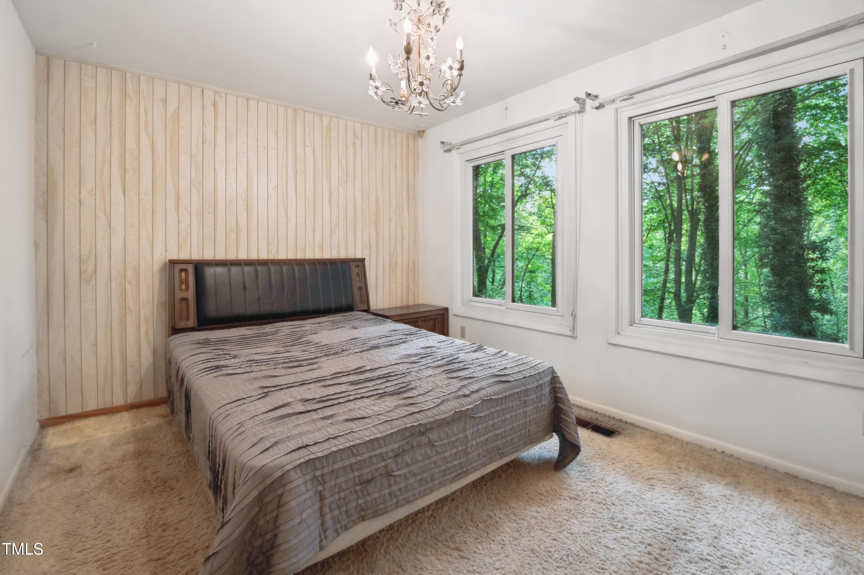 3416 Ocotea Street Raleigh, NC 27607 - Photo 35 of 46 a bedroom with a bed and window