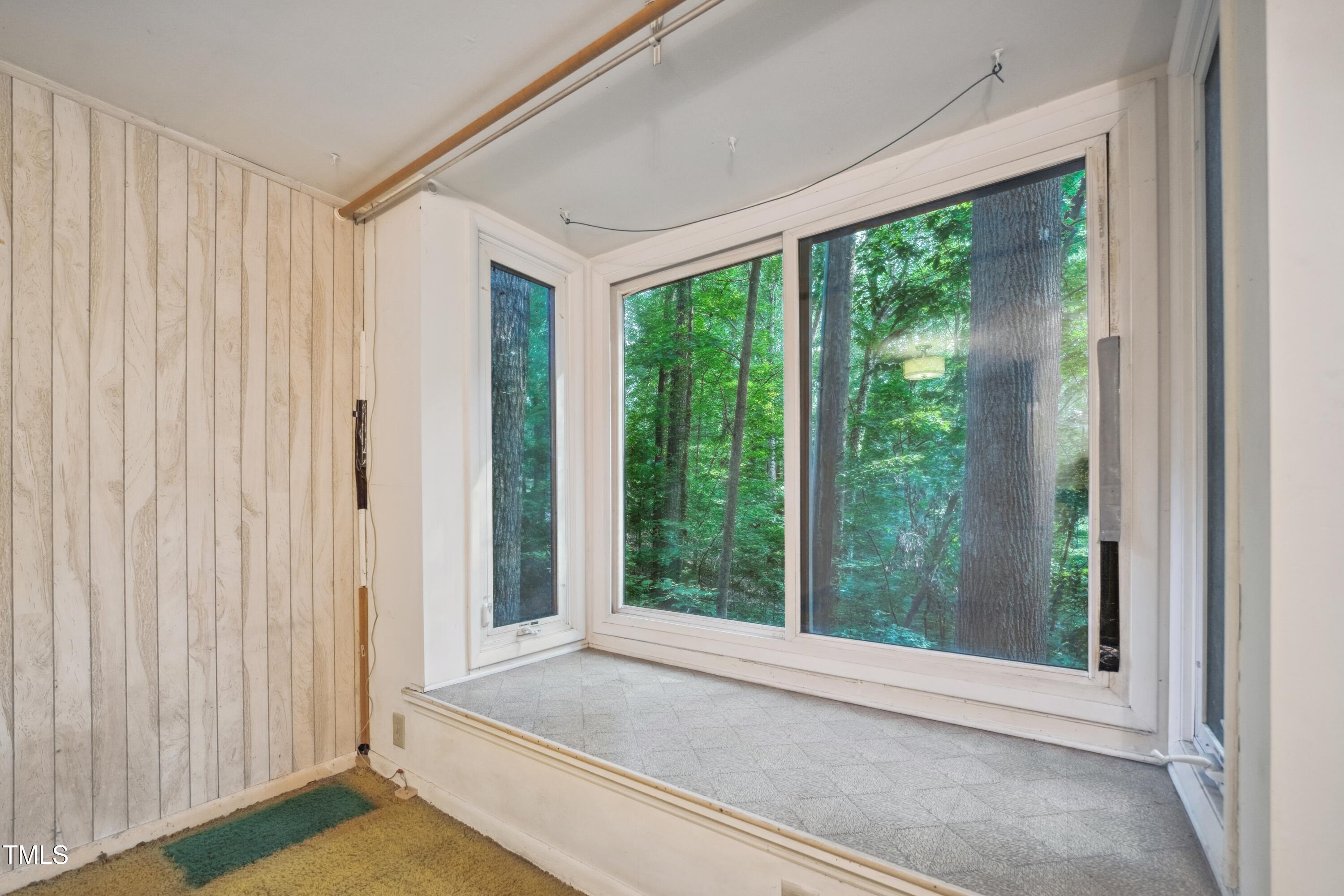 3416 Ocotea Street Raleigh, NC 27607 - Photo 36 of 46 a view of an empty room with wooden floor and a window