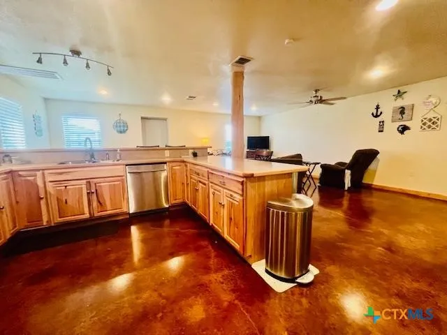a kitchen with stainless steel appliances granite countertop a stove and a sink