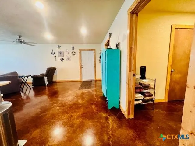a living room with furniture and a mirror