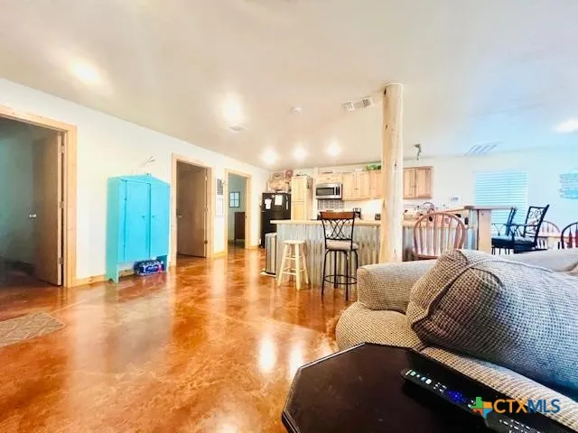 a living room with furniture and a table