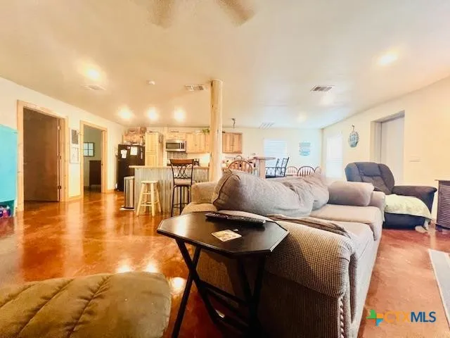 a living room with furniture and a table