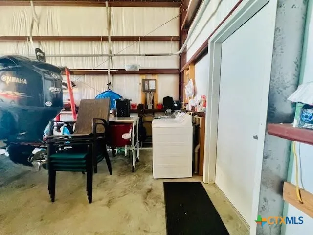 a view of a room with dining area wooden floor and a floor to ceiling window