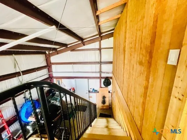 a spacious bedroom with a bed and a couch