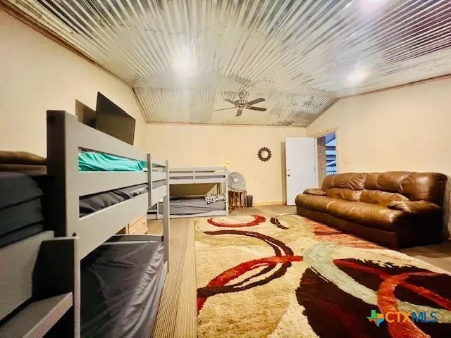 a view of a house with a yard and garage