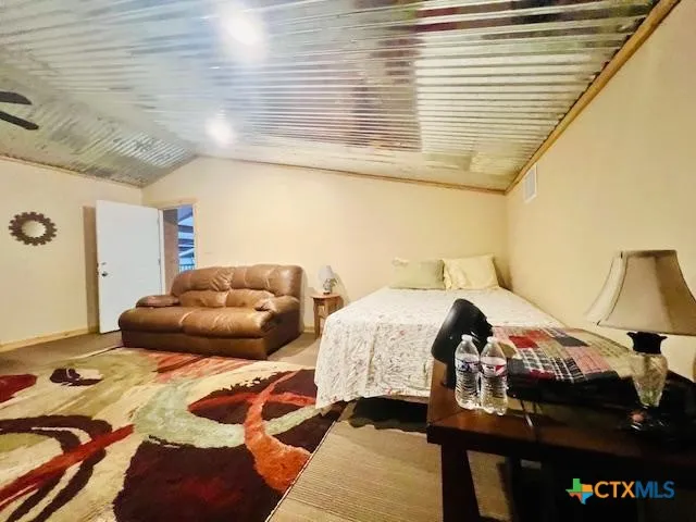 a view of a house with a yard and garage