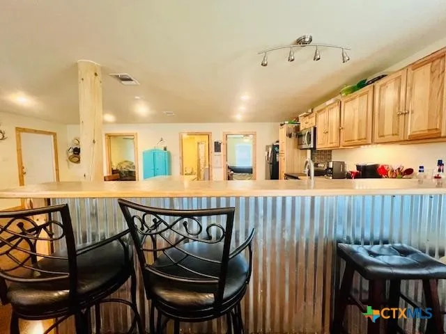 a view of a dining room with furniture and window