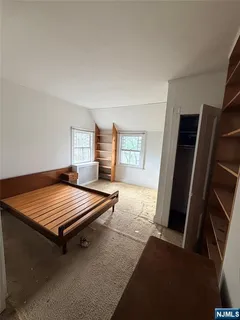 a room with chairs and window