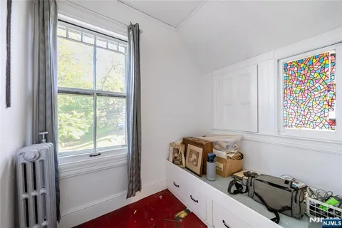 a view of a room with window and furniture