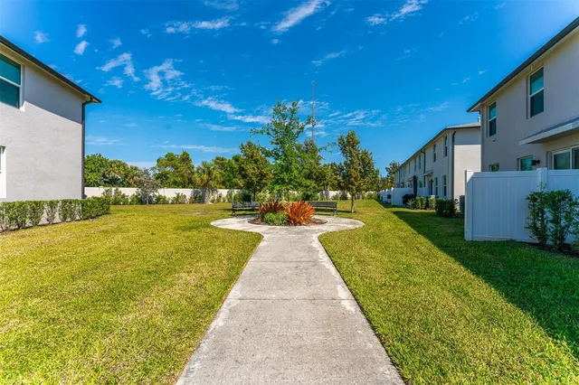 a view of a swimming pool with a yard