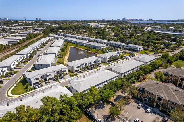 an aerial view of residential houses with outdoor space