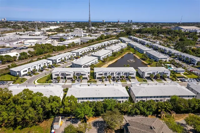 an aerial view of residential building with ocean view