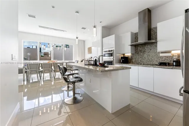 a kitchen with counter top space cabinets and appliances