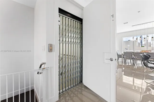a view of a hallway with dining area