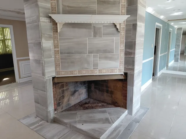 a hallway with a fireplace in it