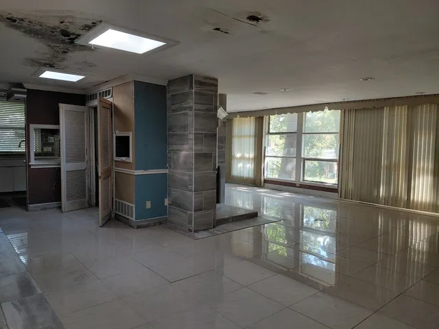 an empty room with windows