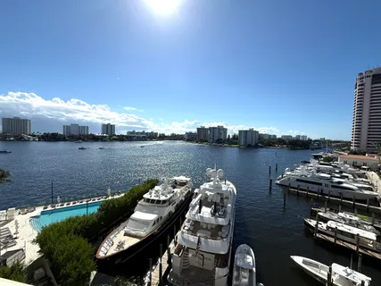 a view of a lake with houses in the back