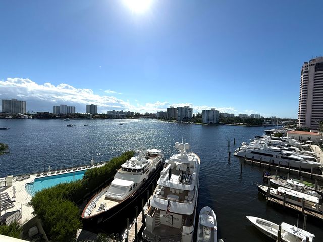 a view of a lake with houses in the back