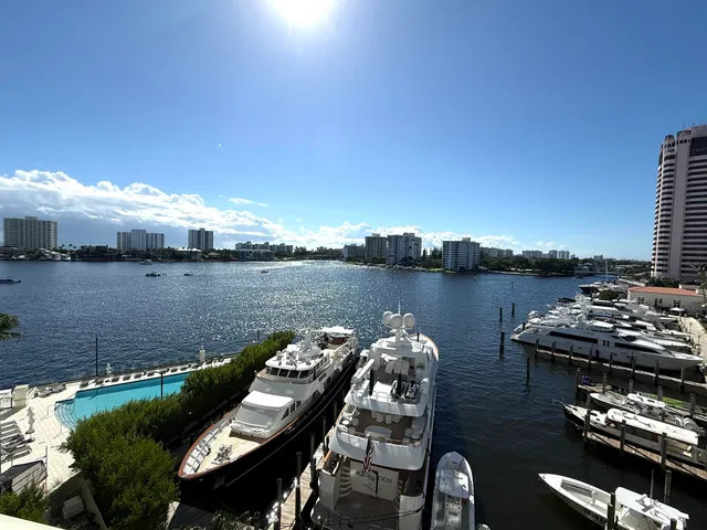 a view of a lake with houses in the back