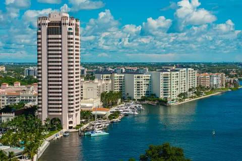 a view of a lake with tall buildings