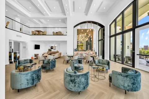 an aerial view of a house with outdoor space and lake view