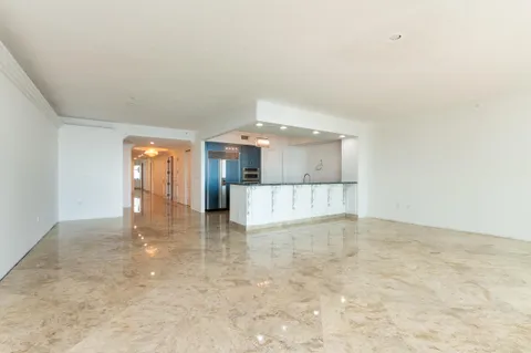 a view of empty room with floor to ceiling window