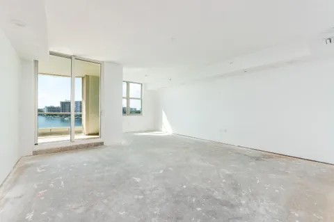 a bedroom with a bed and a mirror