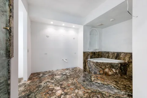 a bathroom with a sink and a shower