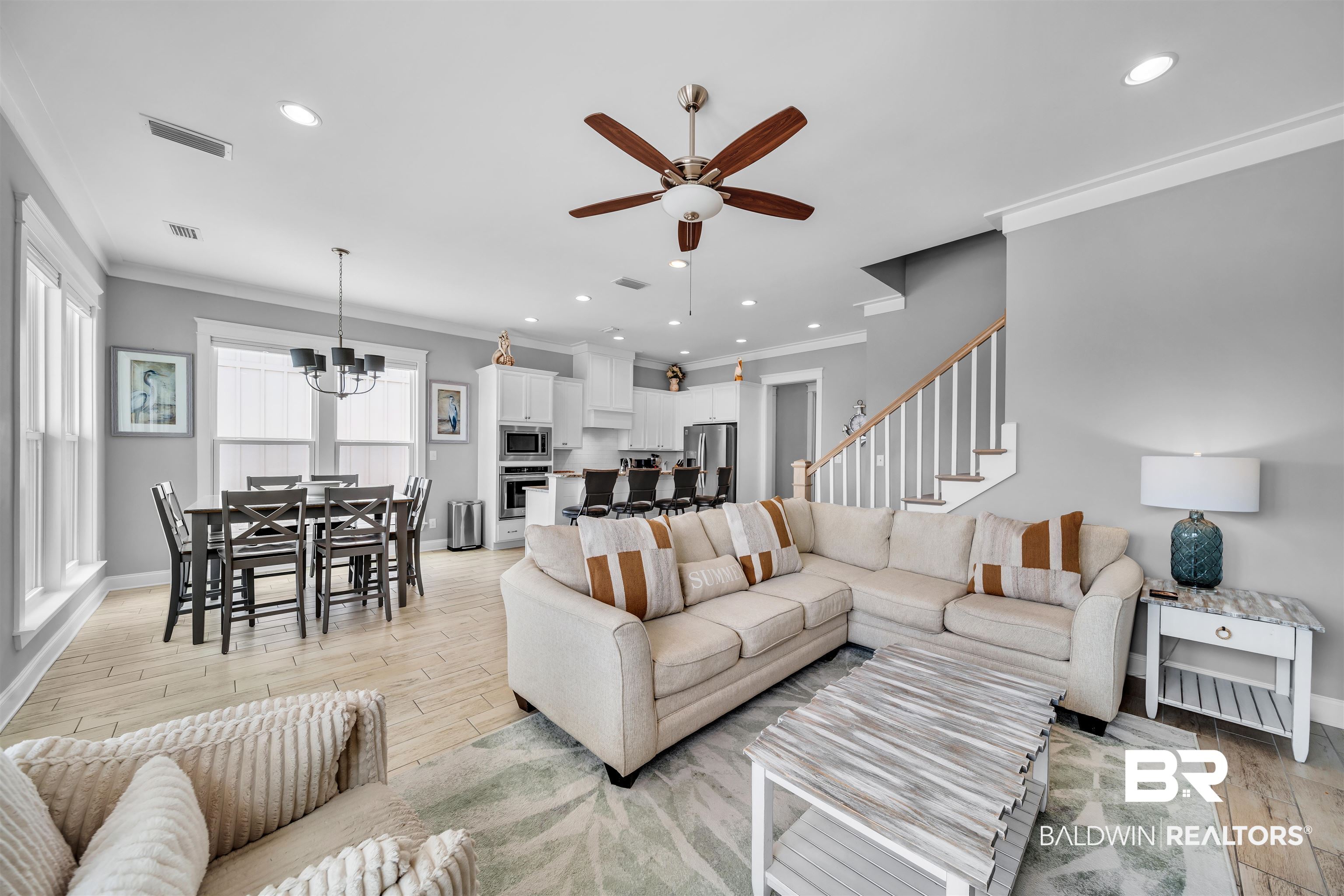 47 Parks Edge Orange Beach, AL 36561 - Photo 3 of 40 Living area featuring ornamental molding, a ceiling fan, light wood-style floors, recessed lighting, and a chandelier
