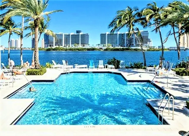 a view of a house with a yard porch and furniture