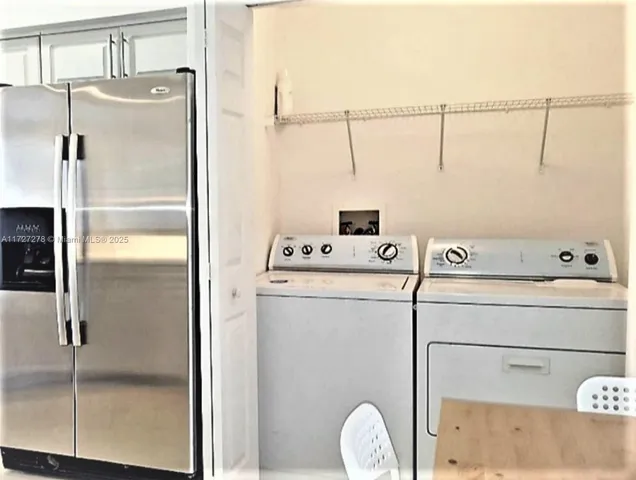 a utility room with washer and dryer