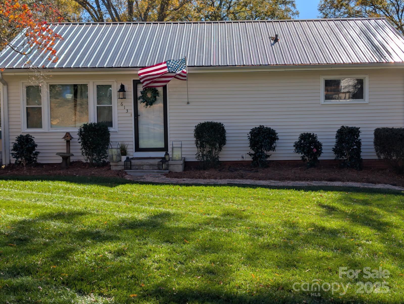 a front view of a house with yard