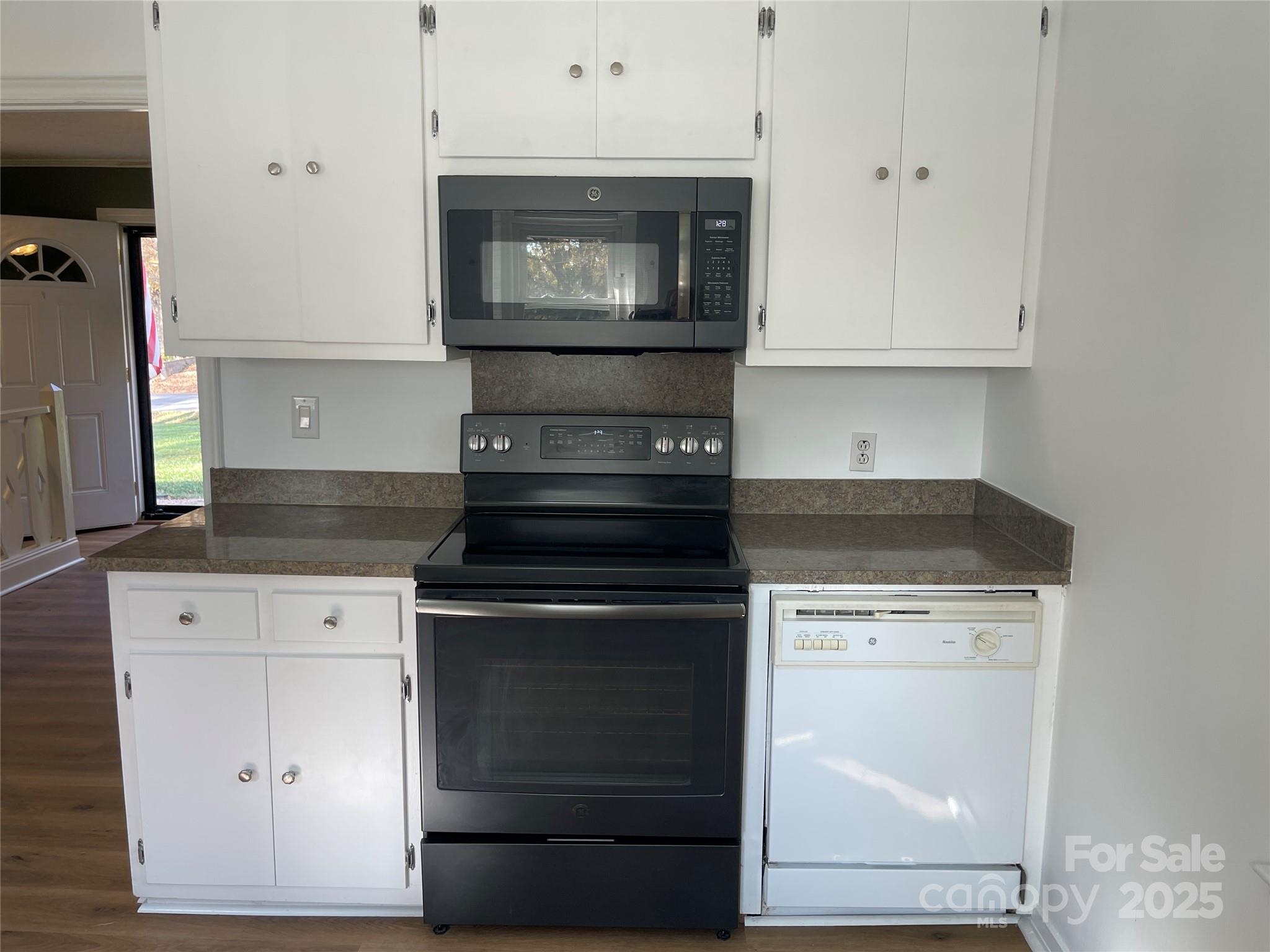 613 Gurley Street Albemarle, NC 28001 - Photo 11 of 43 a stove top oven sitting inside of a kitchen