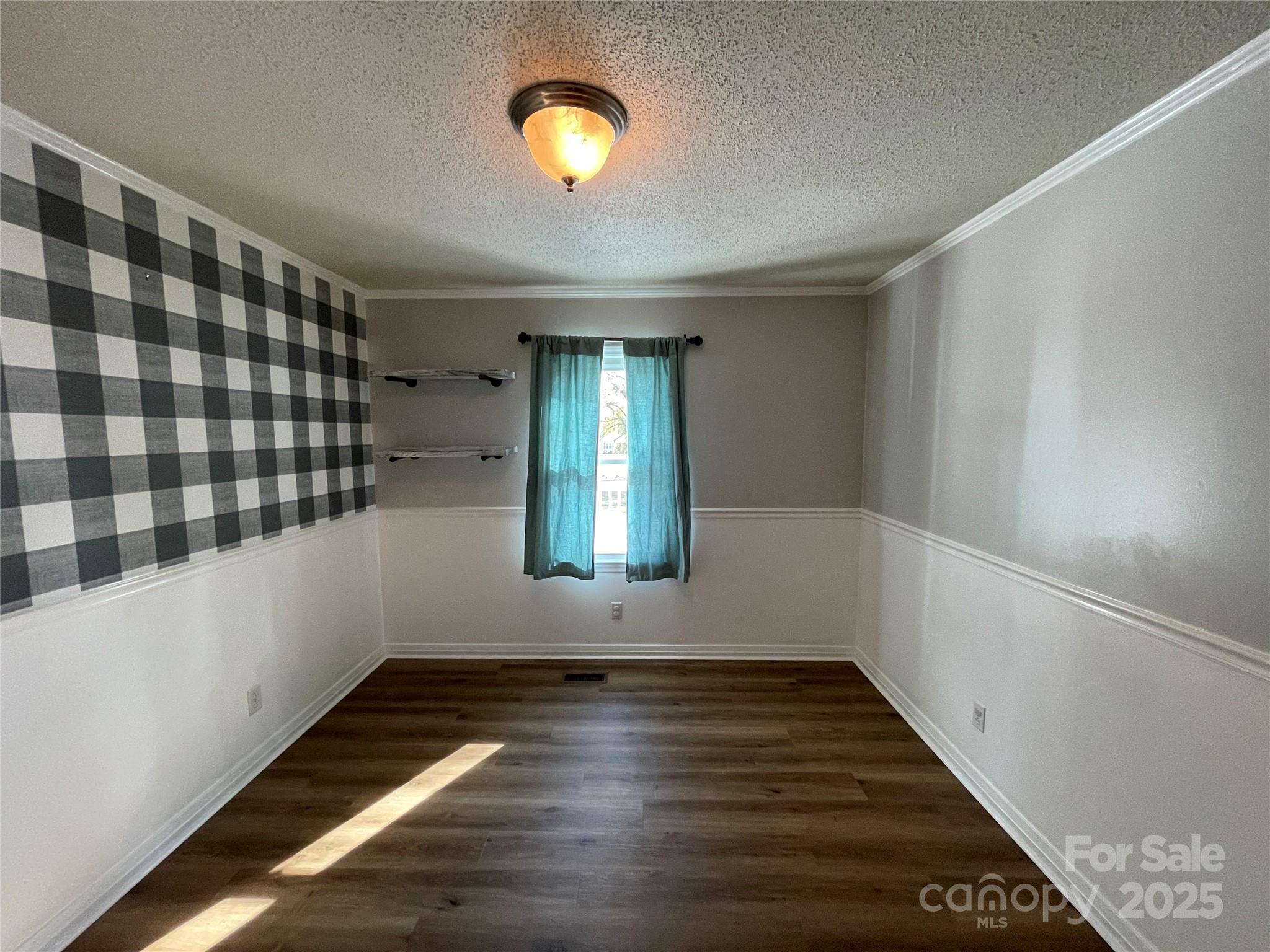 613 Gurley Street Albemarle, NC 28001 - Photo 14 of 43 a view of hallway with stairs and wooden floor