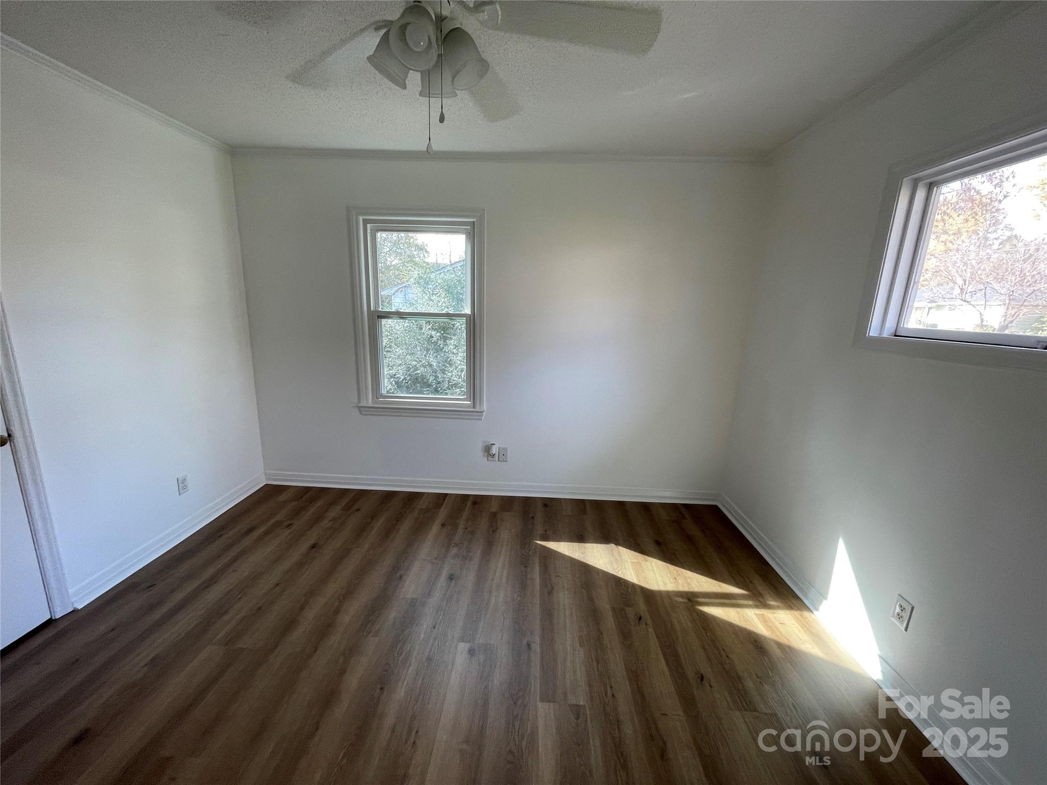 613 Gurley Street Albemarle, NC 28001 - Photo 18 of 43 an empty room with windows