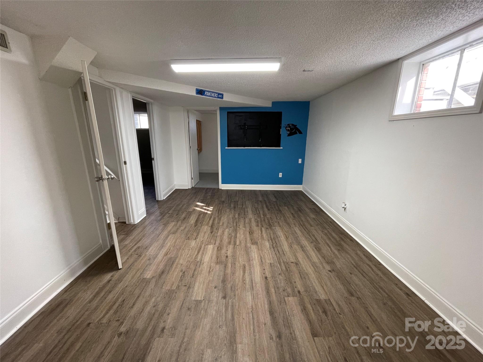 613 Gurley Street Albemarle, NC 28001 - Photo 24 of 43 wooden floor in an empty room with a window